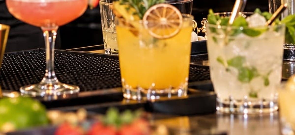 Signature cocktails with fresh garnishes